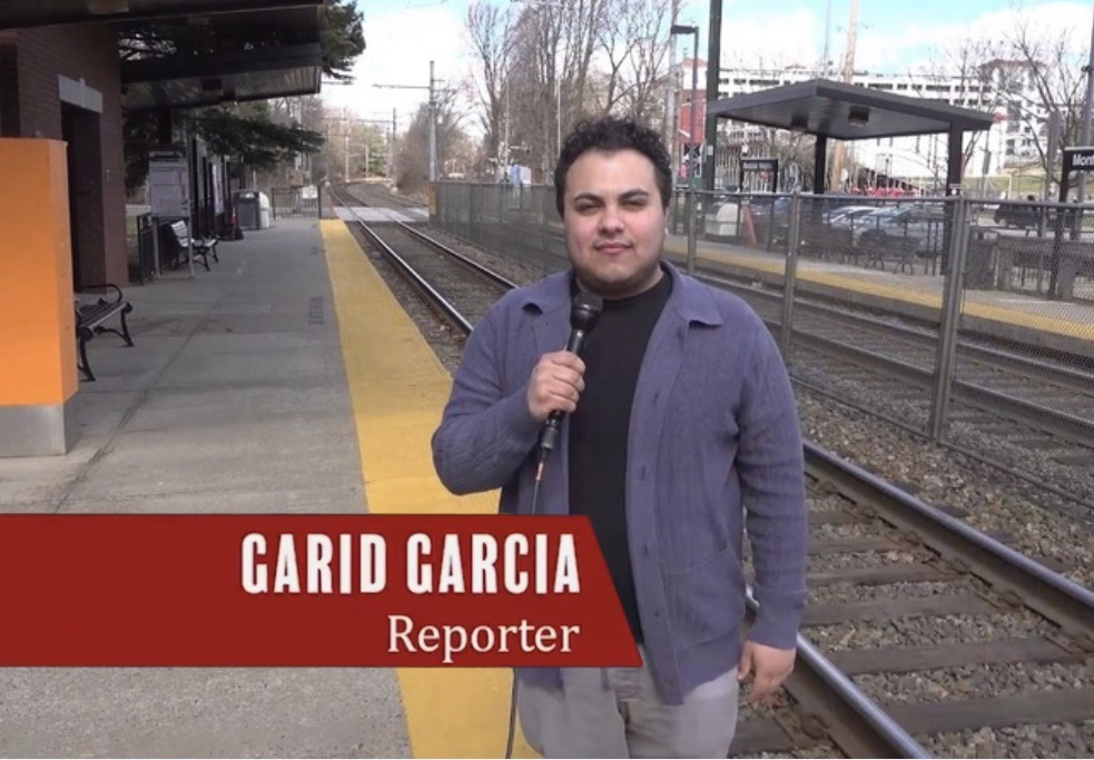 Garid Garcia reporting for Montclair News Lab at a train station